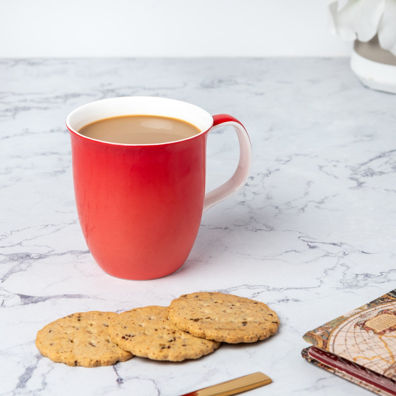Cherry Red Java Mug in fine bone china, lifestyle image styled on countertop with coffee