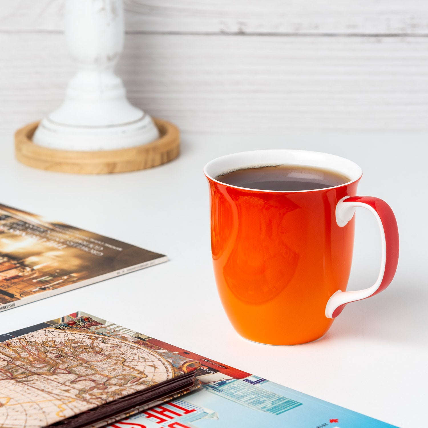 Tangerine Java Mug in fine bone china, lifestyle image styled on countertop with coffee