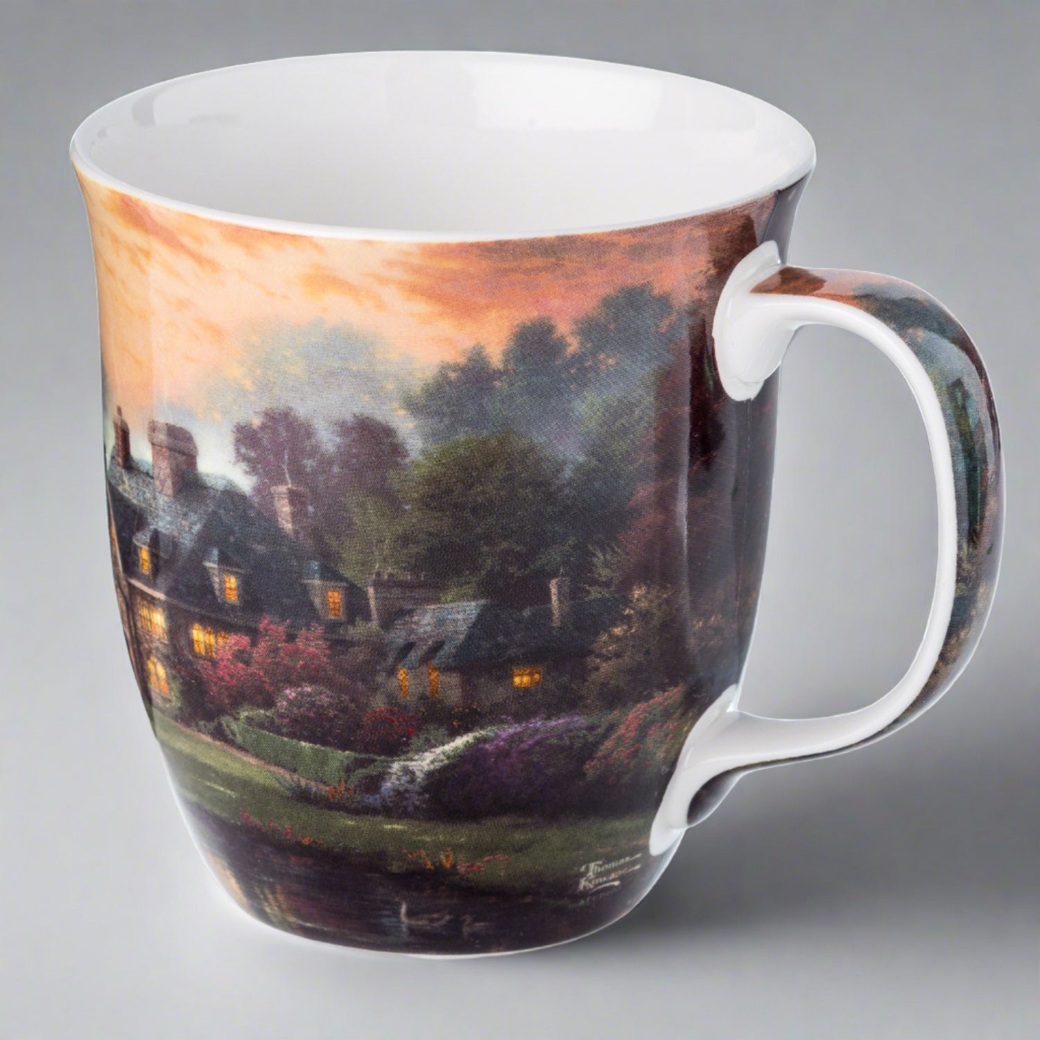 Kinkade Lakeside Manor Java Mug, lifestyle image styled on a grey background