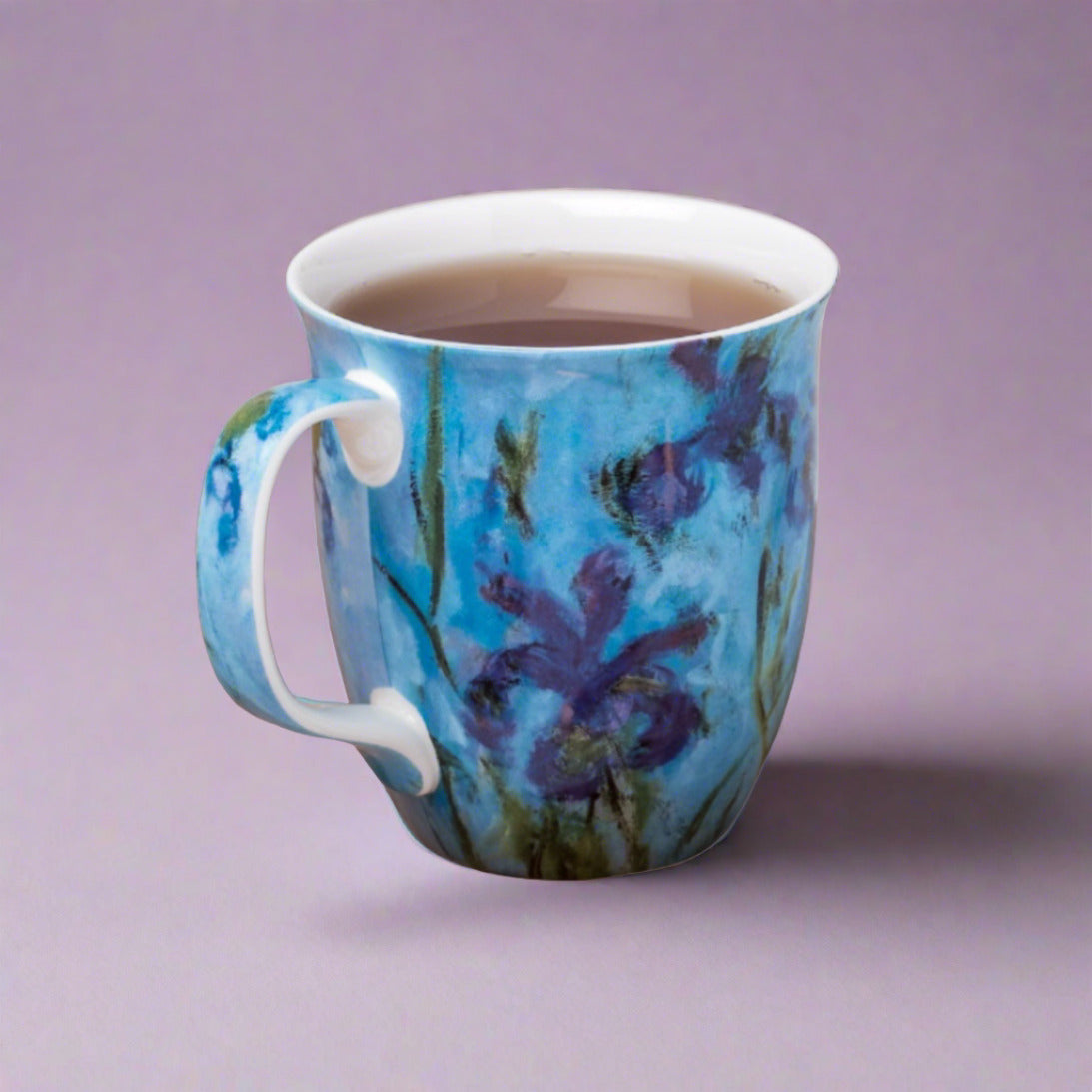 Claude Monet Lilac Irises Java Mug in fine bone china, angled view, rose background, with tea