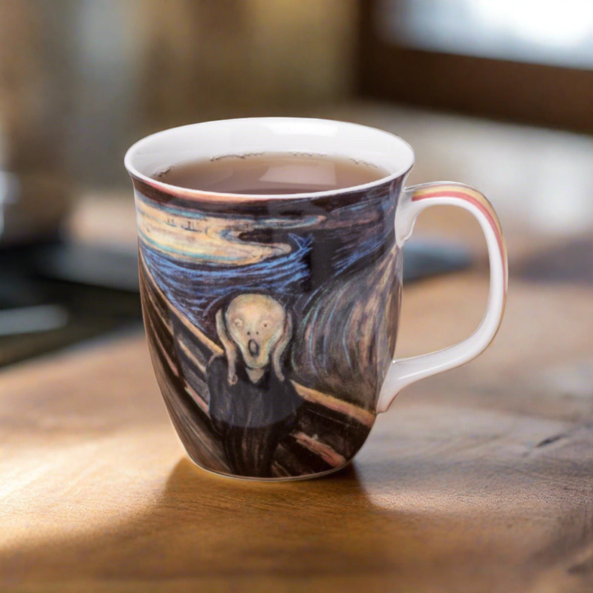 Edvard Munch The Scream Java Mug, lifestyle image styled on a dining table with tea
