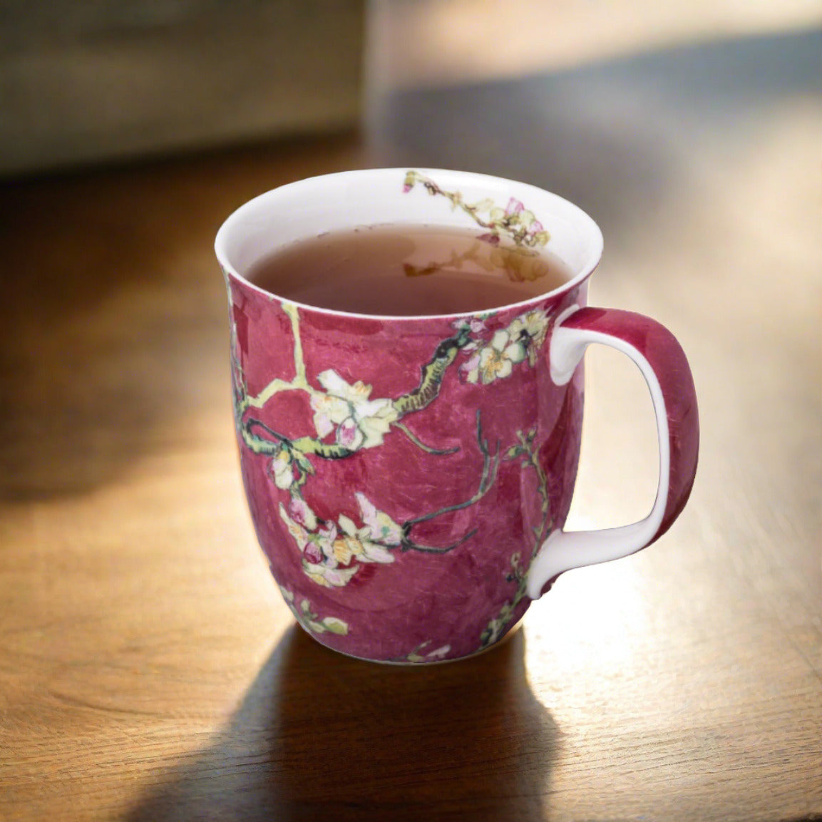 Van Gogh Almond Blossom Red Java Mug, lifestyle image styled on a dining table with tea