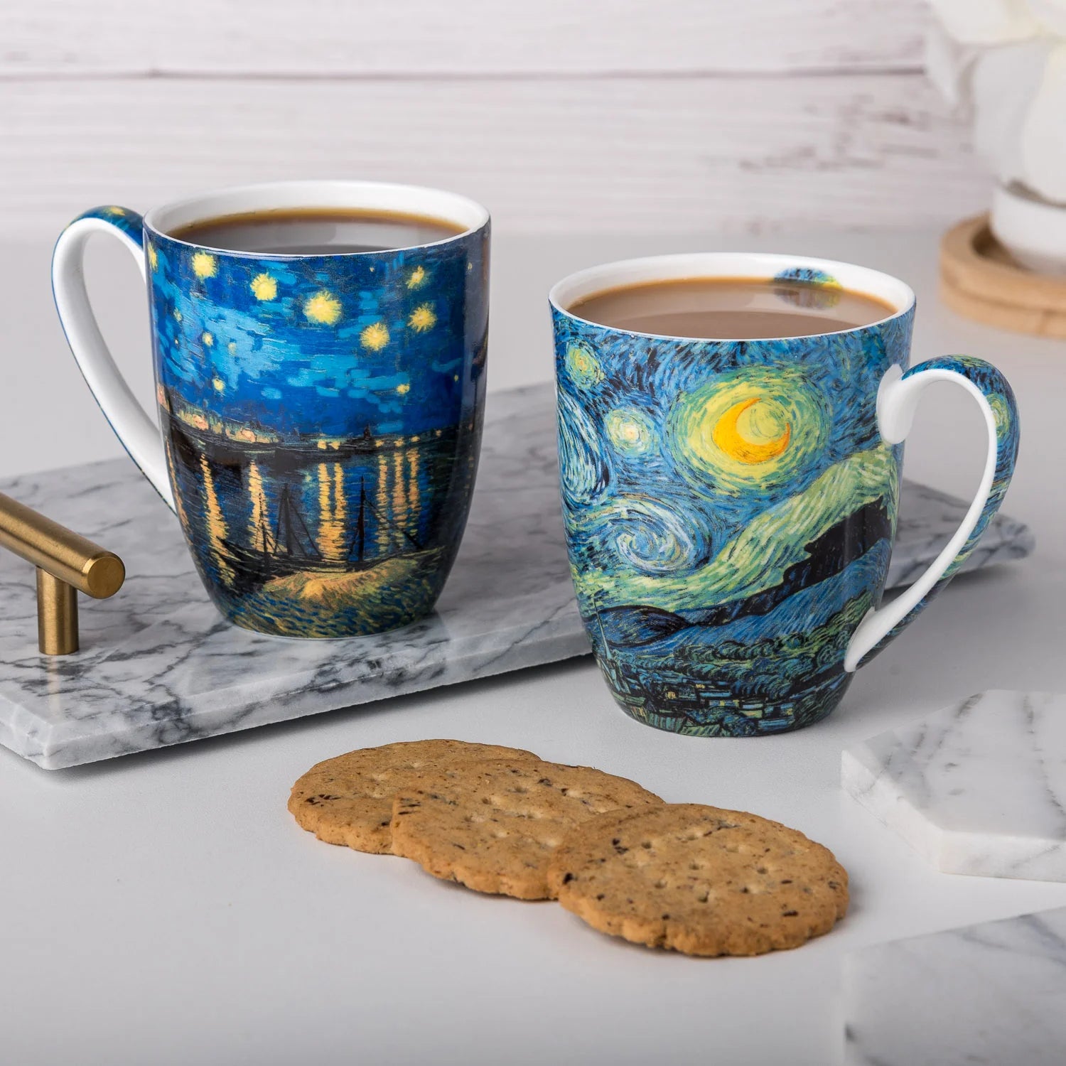 Van Gogh paintings Starry Night and Starry Night Over the Rhone, printed on McIntosh Latte mugs against a white background.