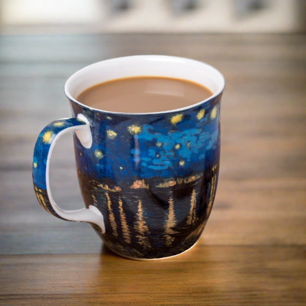 Starry Night Over The Rhone Java Mug, lifestyle image styled on a dining table with coffee