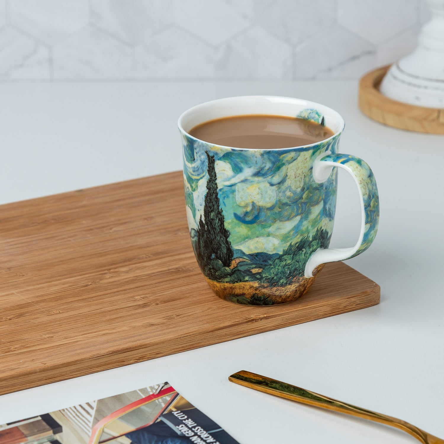 Van Gogh Wheatfields with Cypresses Java Mug, lifestyle image styled on a countertop with cappuccino