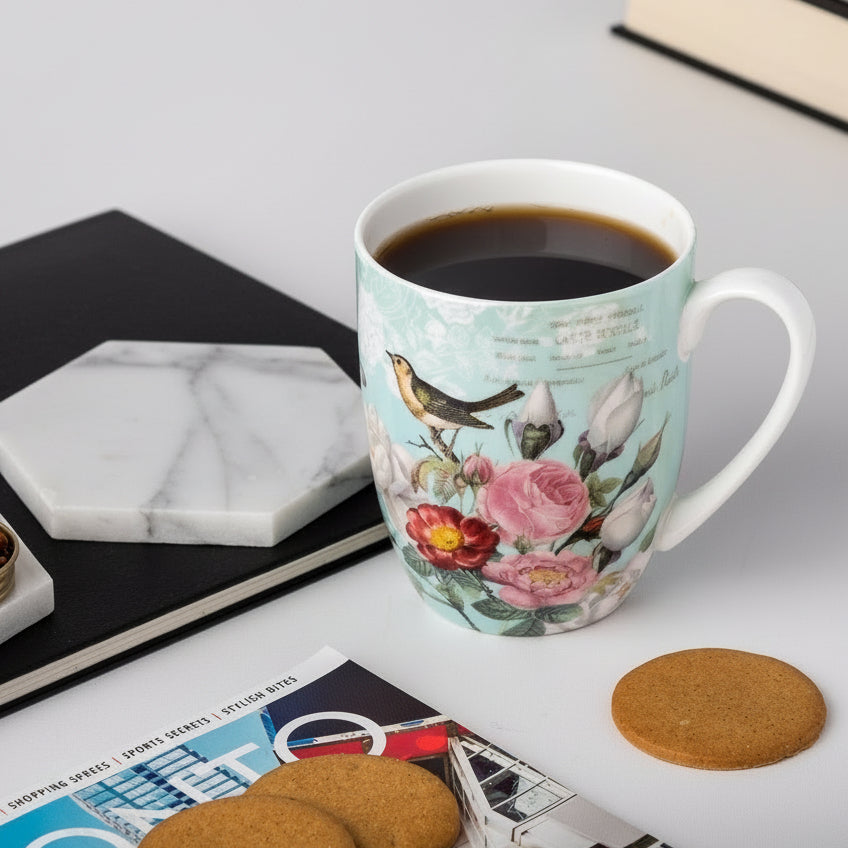 Bird Garden on Blue Latte mug with coffee in a kitchen setting