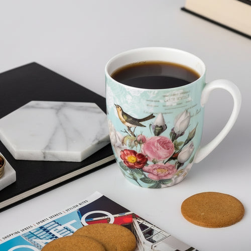 Bird Garden on Blue Latte mug with coffee in a kitchen setting