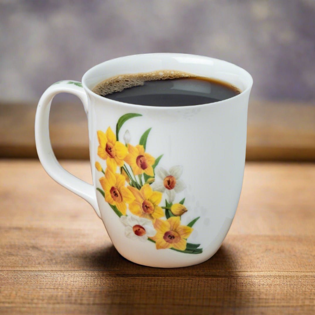 Botanical Flowers Narcissus Java Mug, lifestyle image styled on a dining table with coffee