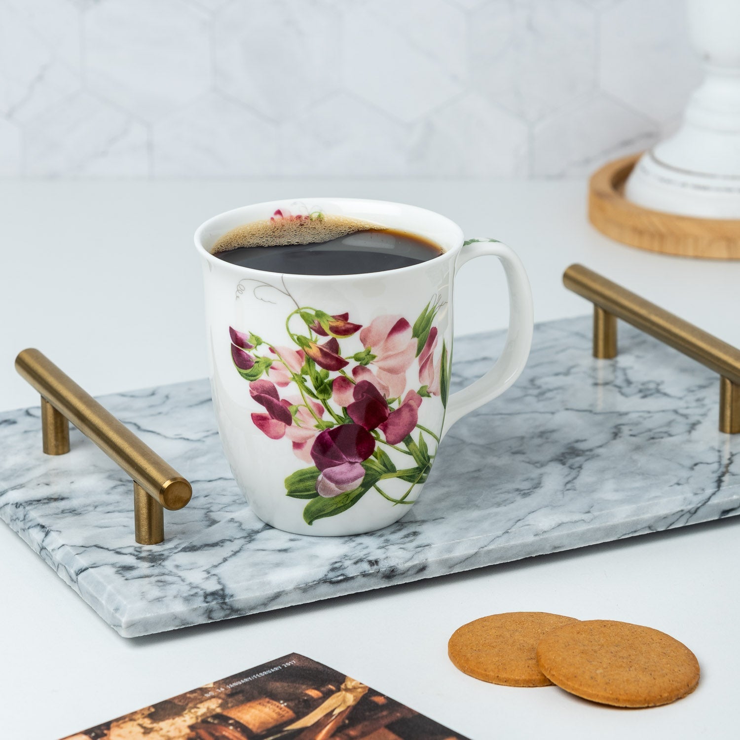 Botanical Flowers Pink Sweet Pea Java Mug lifestyle image styled on a countertop with coffee