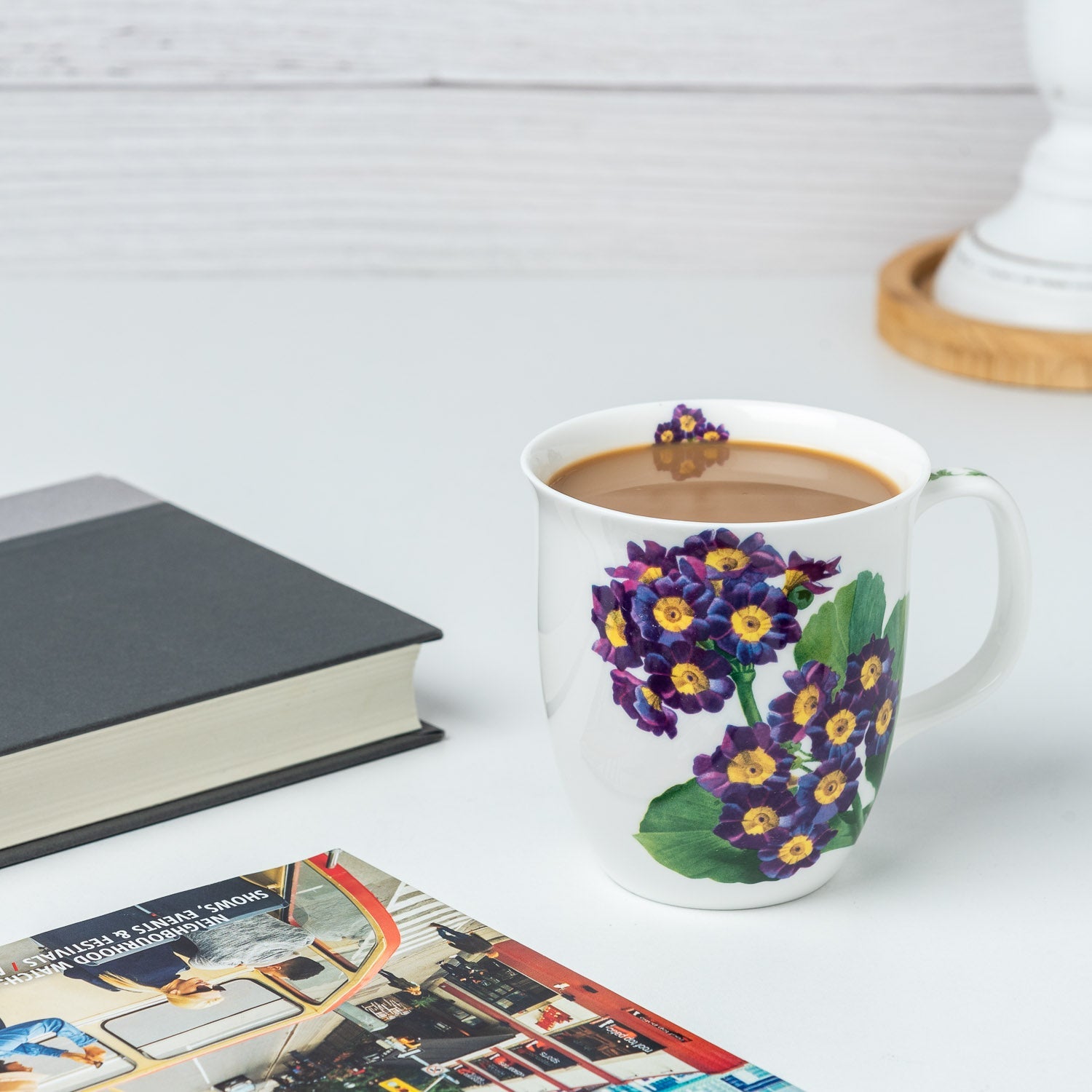 Botanical Flowers Purple Primrose Java Mug, lifestyle image styled on a countertop with cappuccino