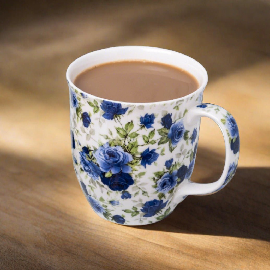 Chintz Dark Blue Roses Java Mug, lifestyle image styled on a dining table with coffee