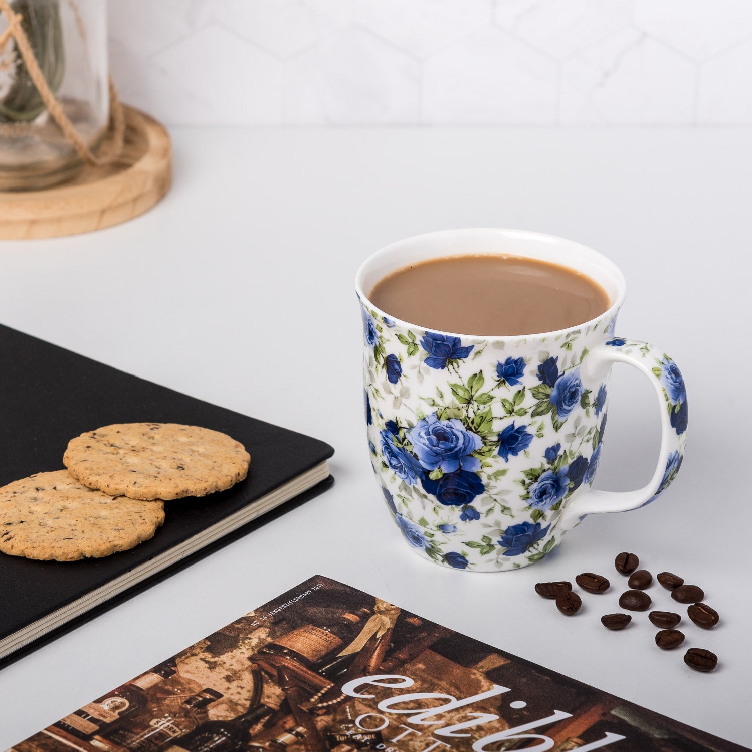 Chintz Dark Blue Roses Java Mug, lifestyle image styled on a countertop with coffee