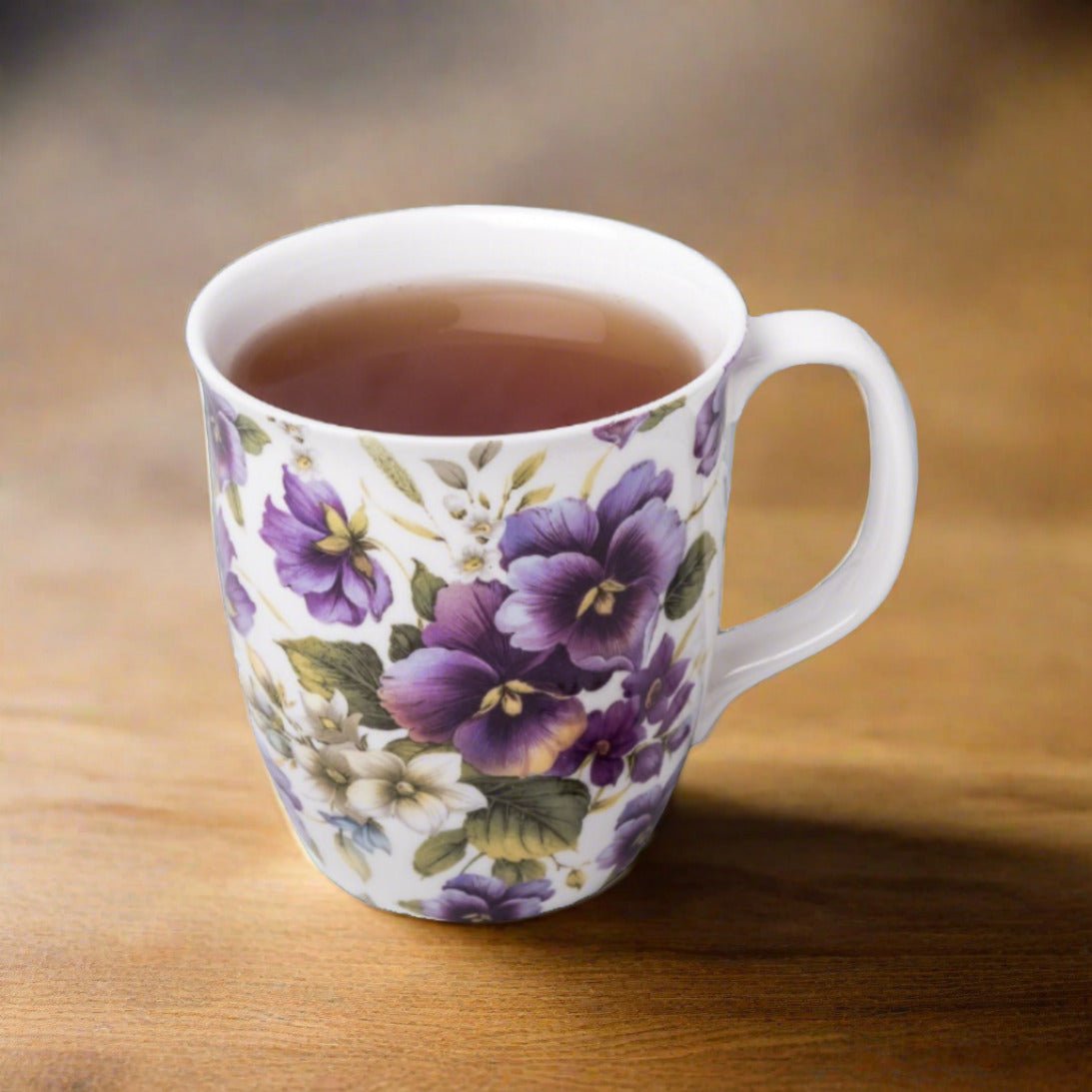Chintz Purple Pansies Java Mug, lifestyle image styled on a dining table with tea