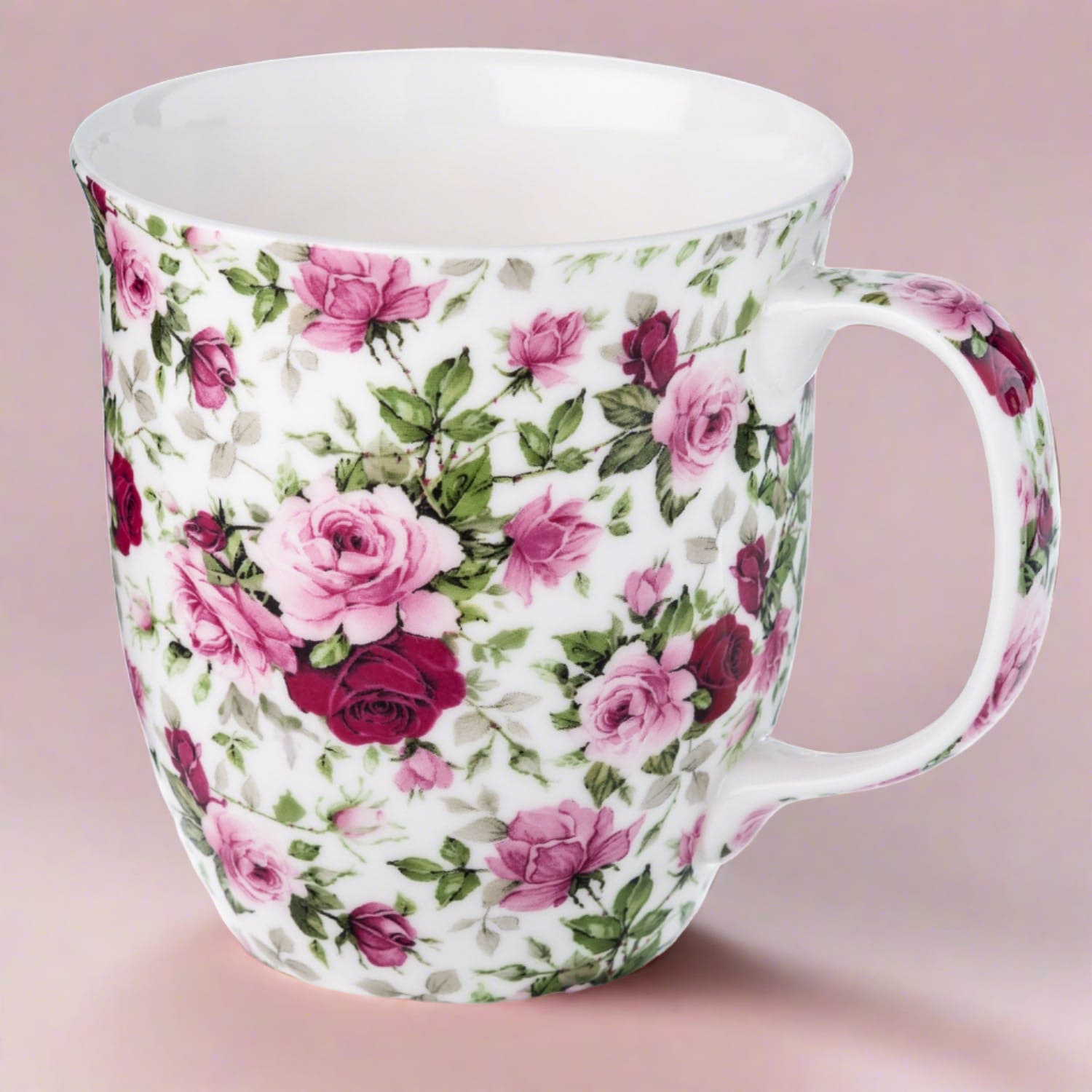 Chintz Red & Pink Roses Java Mug in fine bone china, front view, handle right, pink background