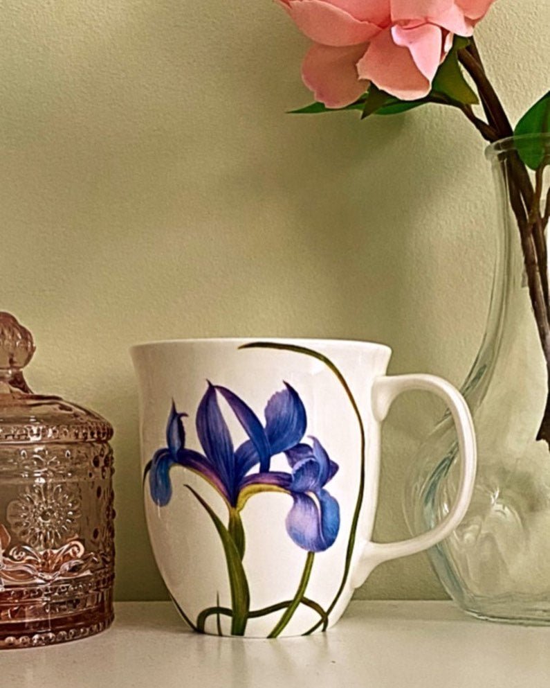 Garden Collection Blue Iris Java Mug, lifestyle image styled in a living room with flowers