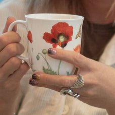 Garden Collection Poppies Java Mug, lifestyle image shown in hand