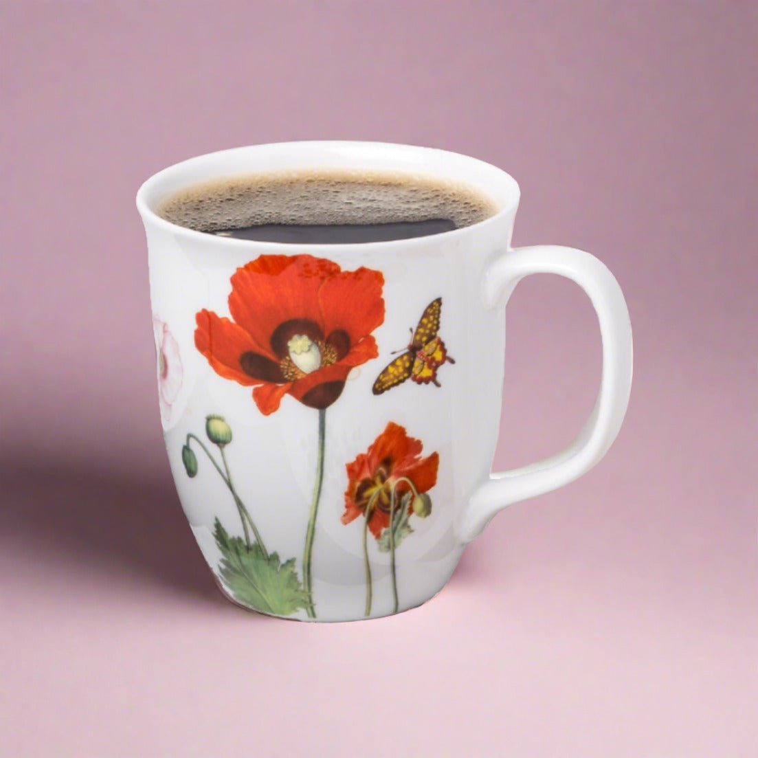 Garden Collection Poppies Java Mug, lifestyle image styled with coffee, pink background