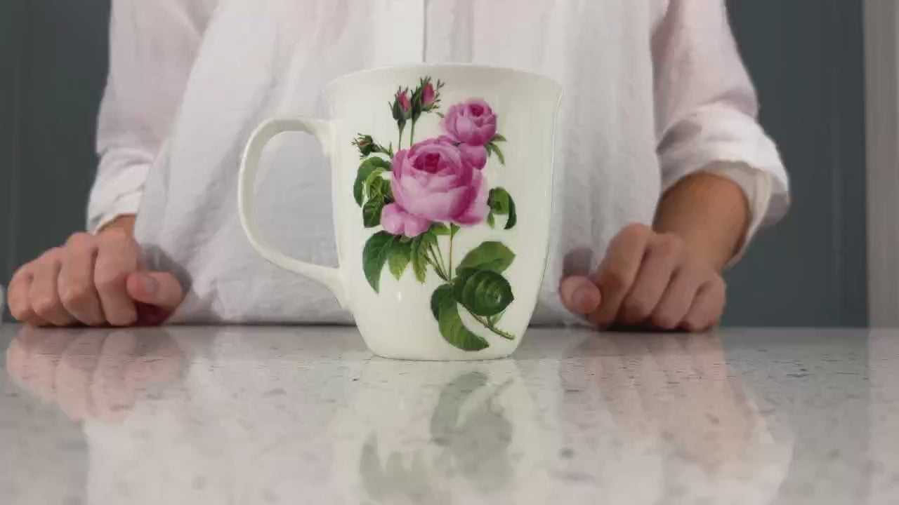 Botanical Flowers Pink Rose Java Mug, product video preview, styled on a countertop with coffee