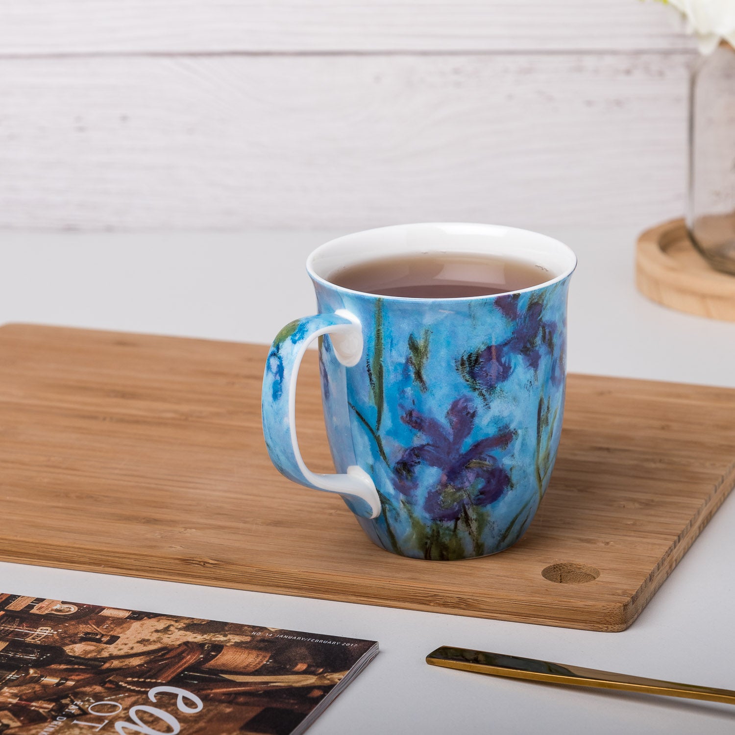 Claude Monet Lilac Irises Java Mug, lifestyle image styled on a countertop with tea