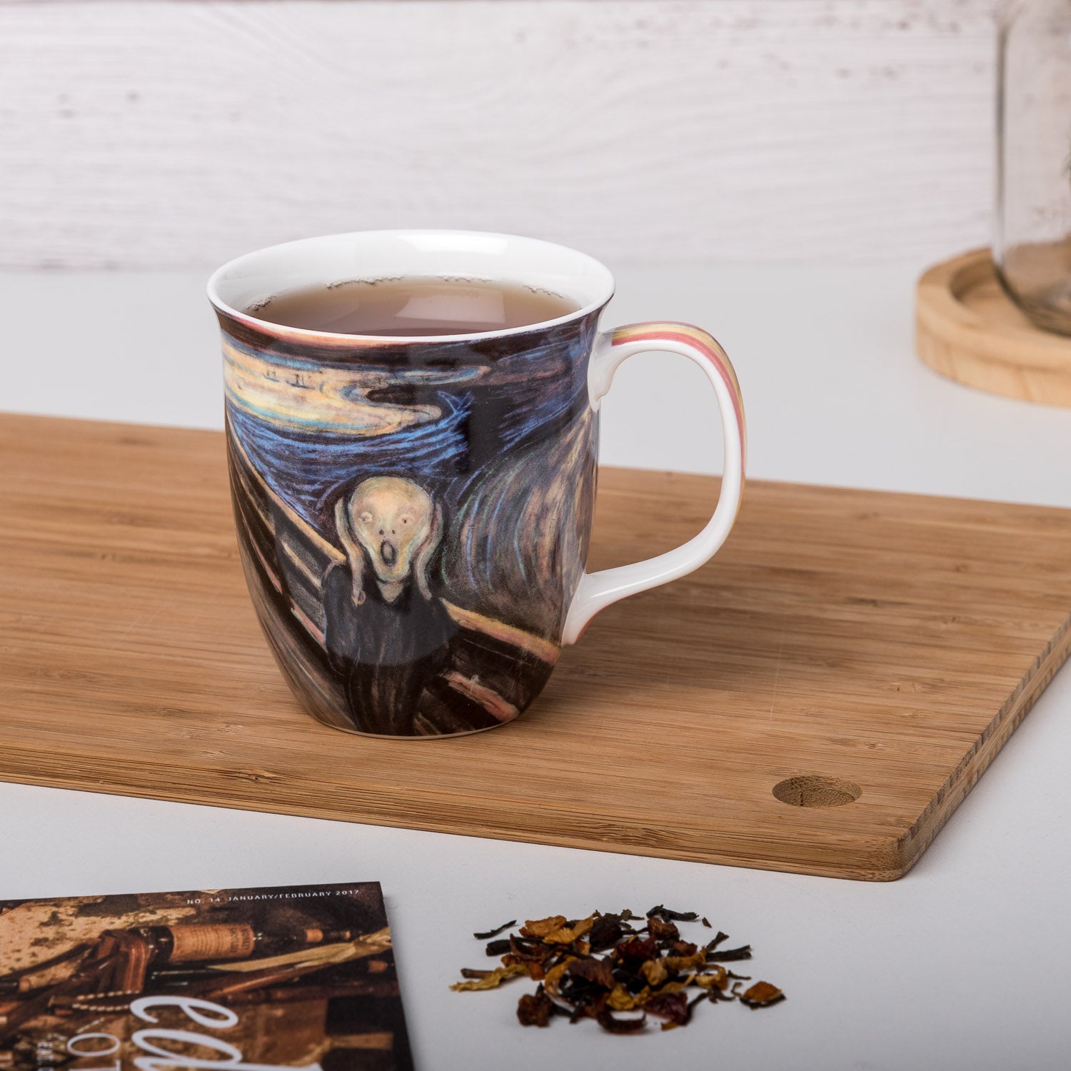 Edvard Munch The Scream Java Mug, lifestyle image styled on a countertop with tea