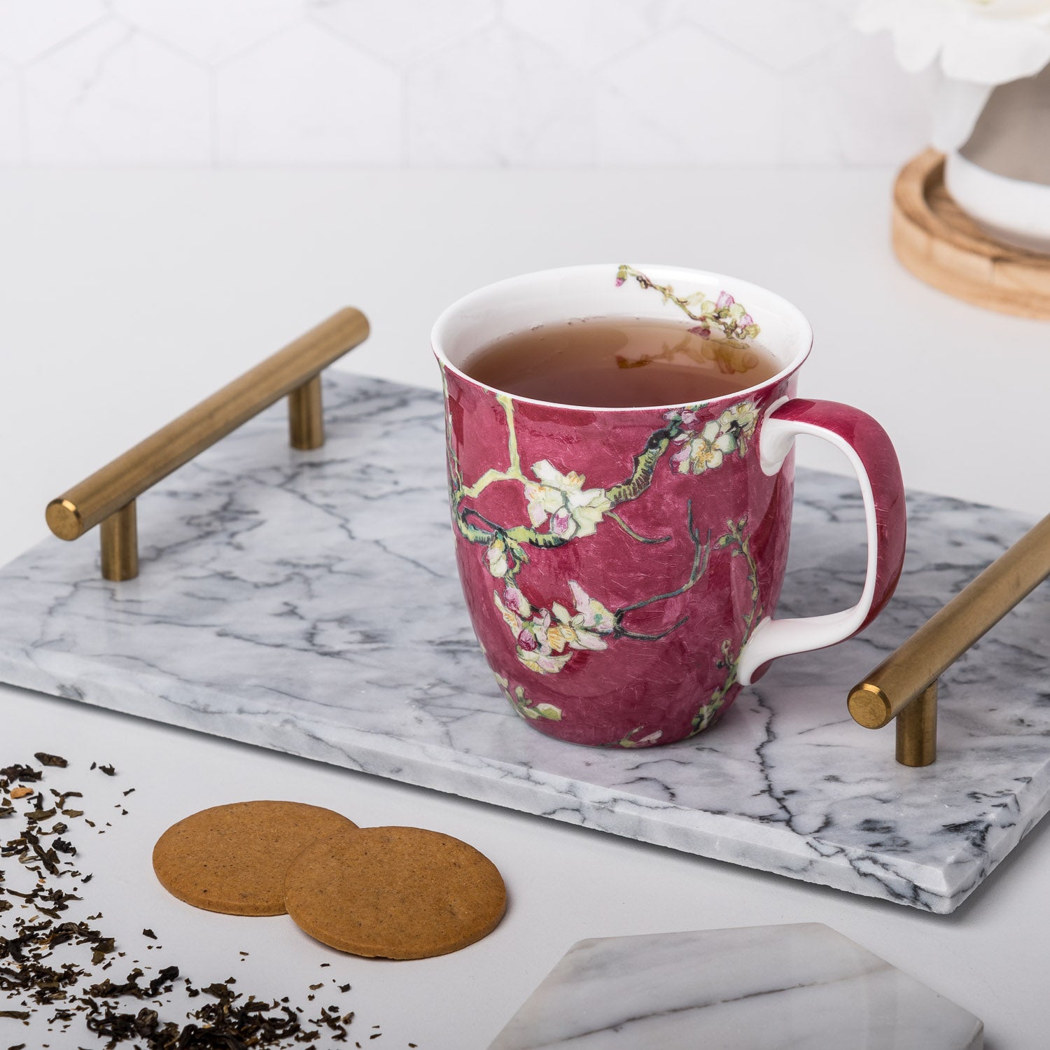 Van Gogh Almond Blossom Red Java Mug, lifestyle image styled on a countertop with tea and cookies