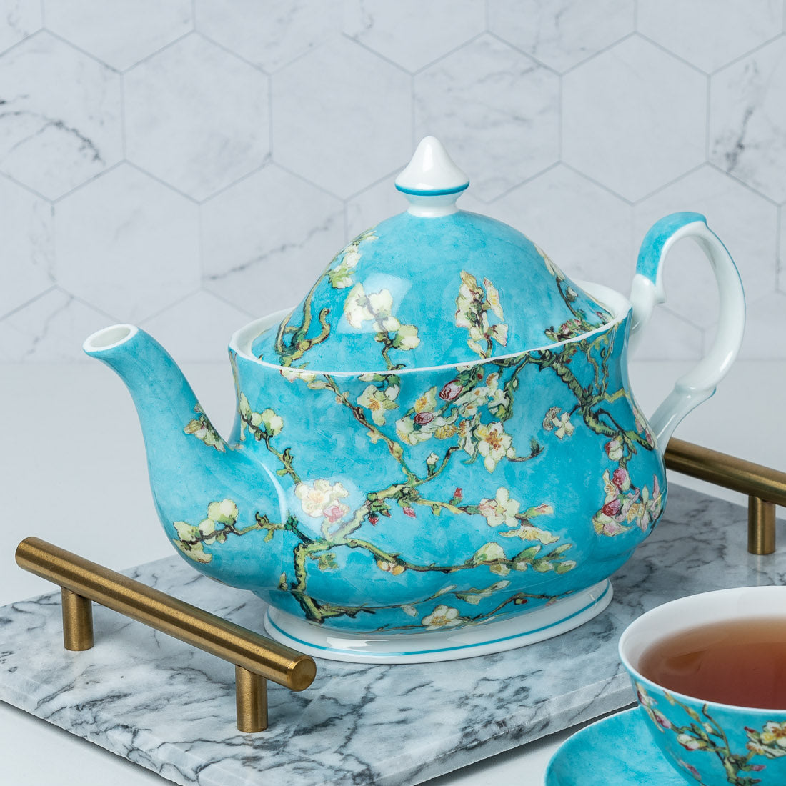 Van Gogh Almond Blossom Teapot lifestyle image styled on a countertop with tea