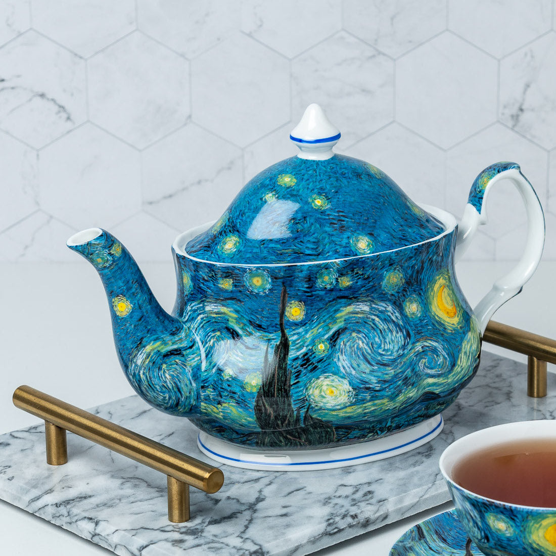Van Gogh Starry Night Teapot lifestyle image styled on a countertop with tea