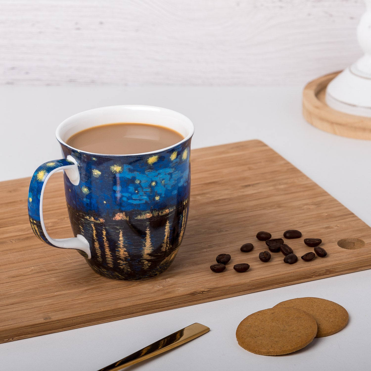 Starry Night Over The Rhone Java Mug, lifestyle image styled on a countertop with coffee